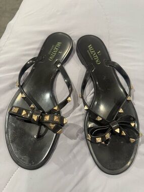 Valentino Garavani Black Jelly Bow Sandals with Gold Studs